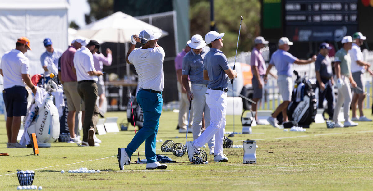 Golfers practice their drive during the first round of the Shriners Children's Open tournament ...