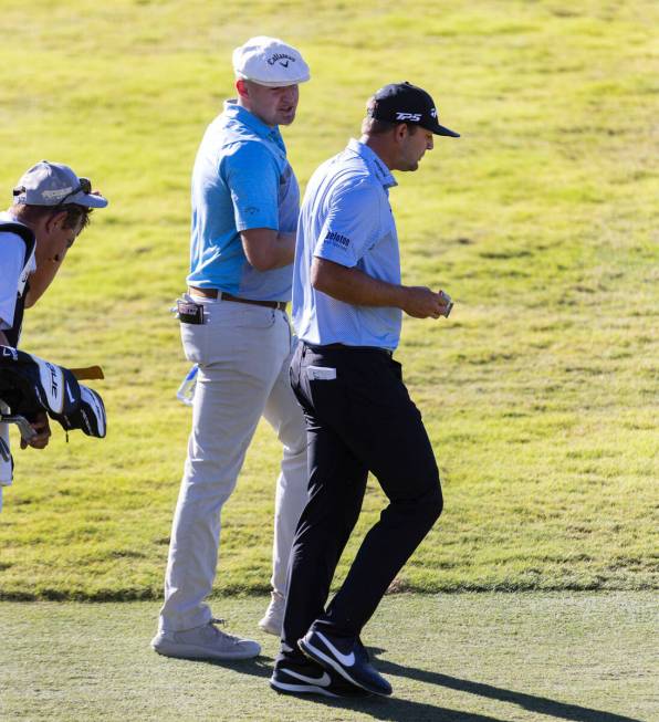 Harry Hall, left, and Taylor Montgomery walk to the tenth green during the first round of the S ...