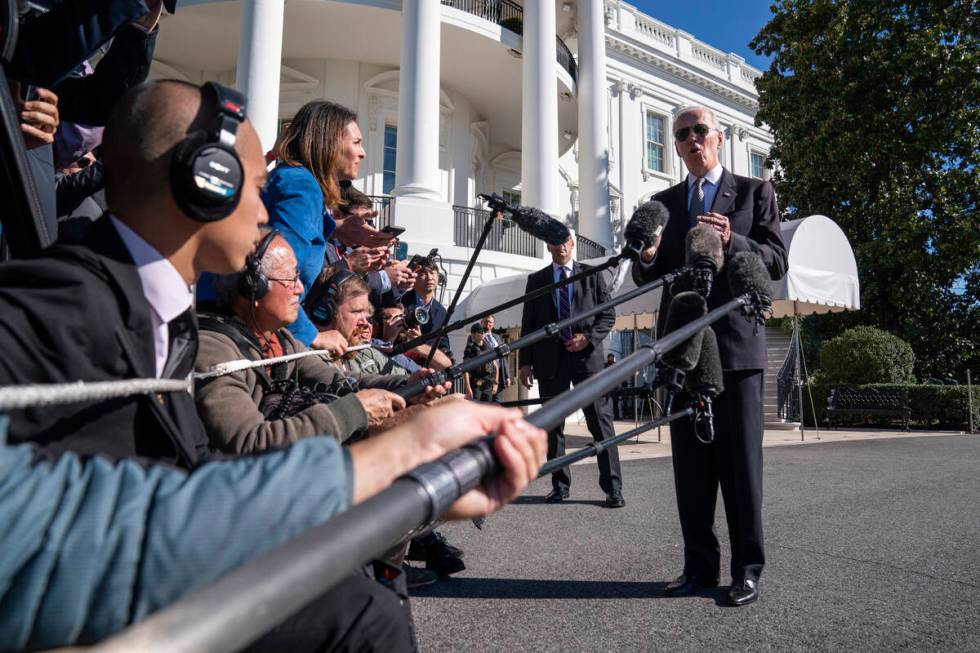 President Joe Biden talks to reporters before boarding Marine One on the South Lawn of the Whit ...