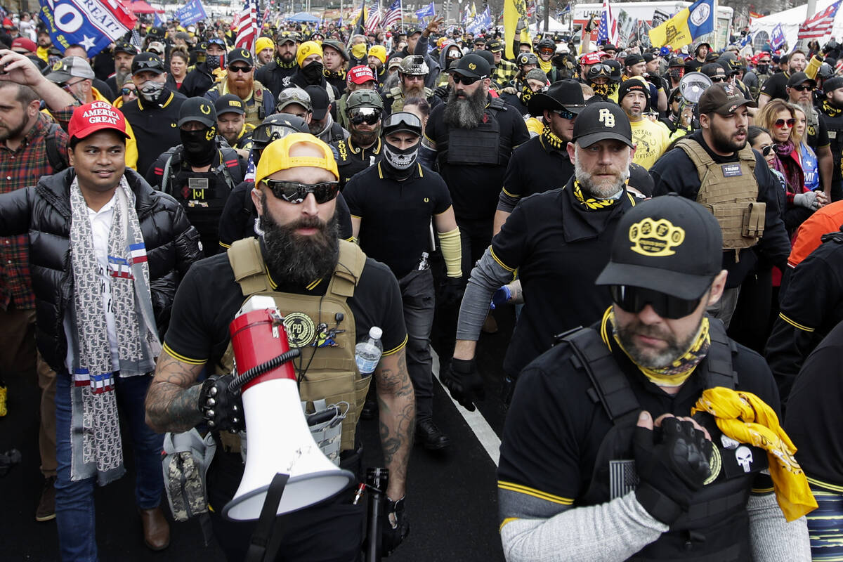 Far-right Proud Boys member Jeremy Joseph Bertino, second from left, joins other supporters of ...