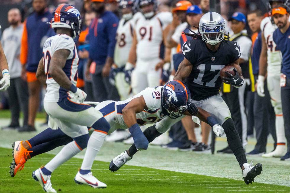 Raiders wide receiver Davante Adams (17) runs down the sidelines following a catch as Denver Br ...