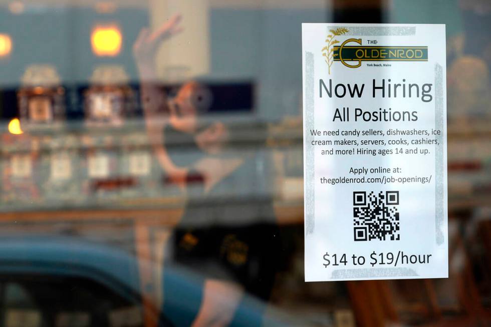 FILE - A sign advertises for help The Goldenrod, a popular restaurant and candy shop, Wednesday ...