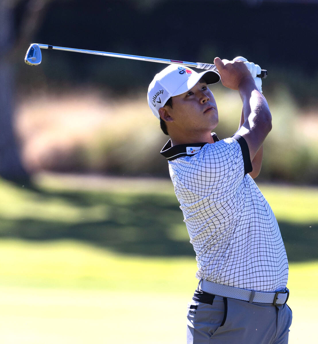 Si Woo Kim, of South Korea, watches his drive to the tenth green during the second round of the ...