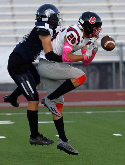 Coronado’s Scott Holper (26) fails to make the catch against Shadow Ridge’s Tanne ...