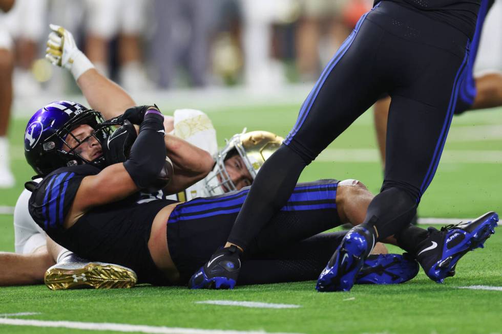 Brigham Young Cougars linebacker Max Tooley (31) intercepts the ball against the Notre Dame Fig ...