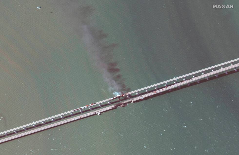 This satellite image provided by Maxar Technologies shows damage to the Kerch Bridge, which con ...