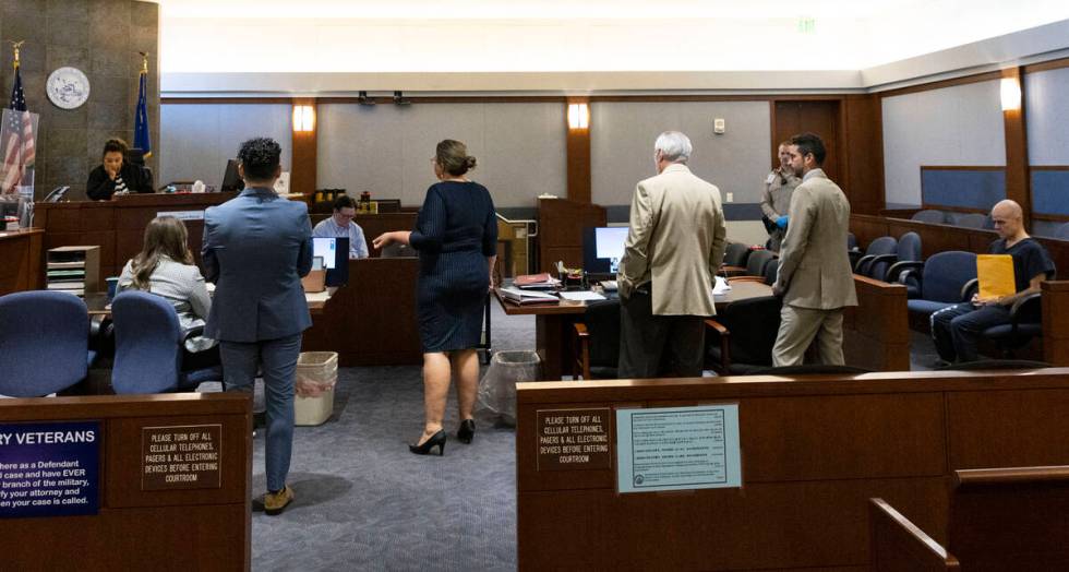 Maggie McLetchie, representing the Review-Journal, center, addresses the court as Judge Karen-B ...