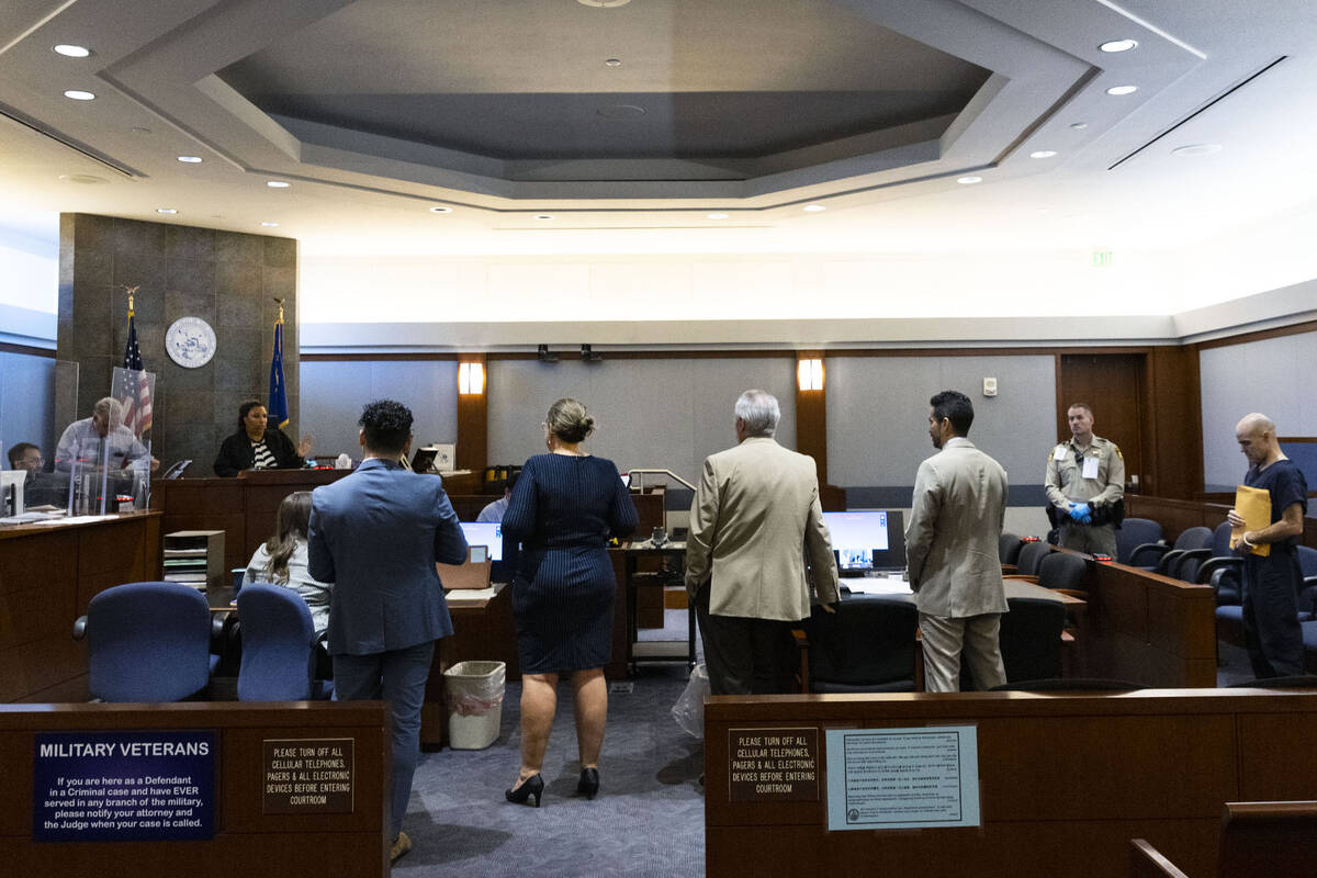 Judge Karen-Bennett-Haron, left, presides over Robert Telles' court hearing in the civil case a ...