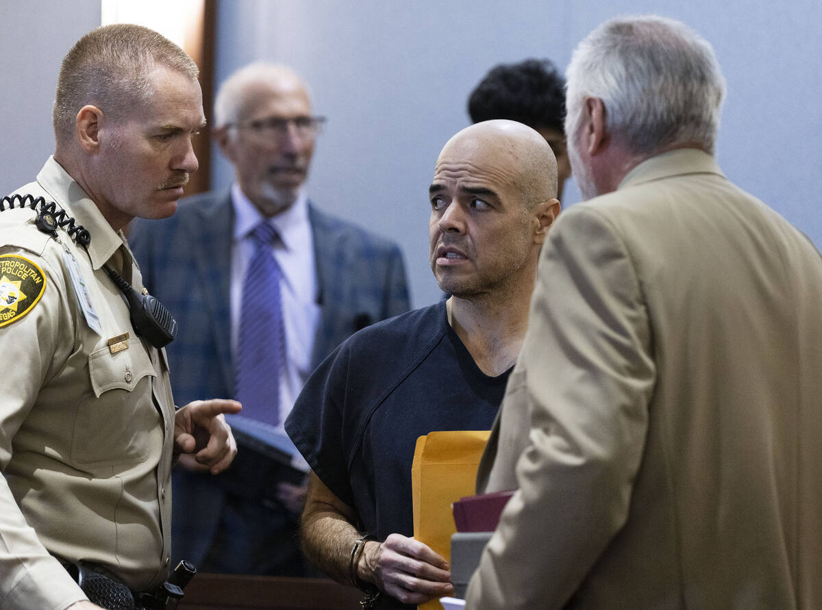 Robert Telles is led out of the courtroom after a court hearing in the civil case at the Region ...