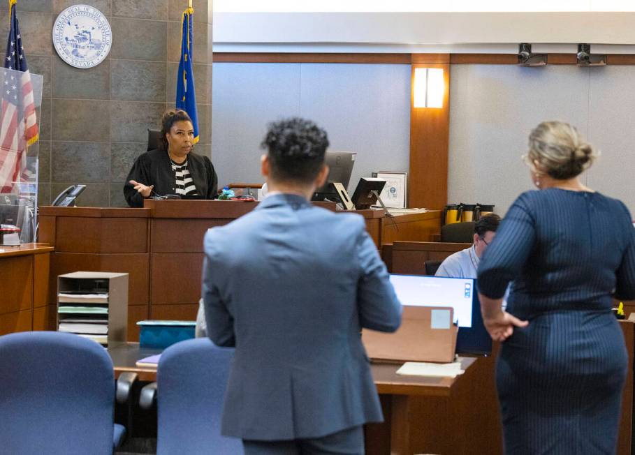 Judge Karen-Bennett-Haron, left, presides over Robert Telles' court hearing in the civil case a ...