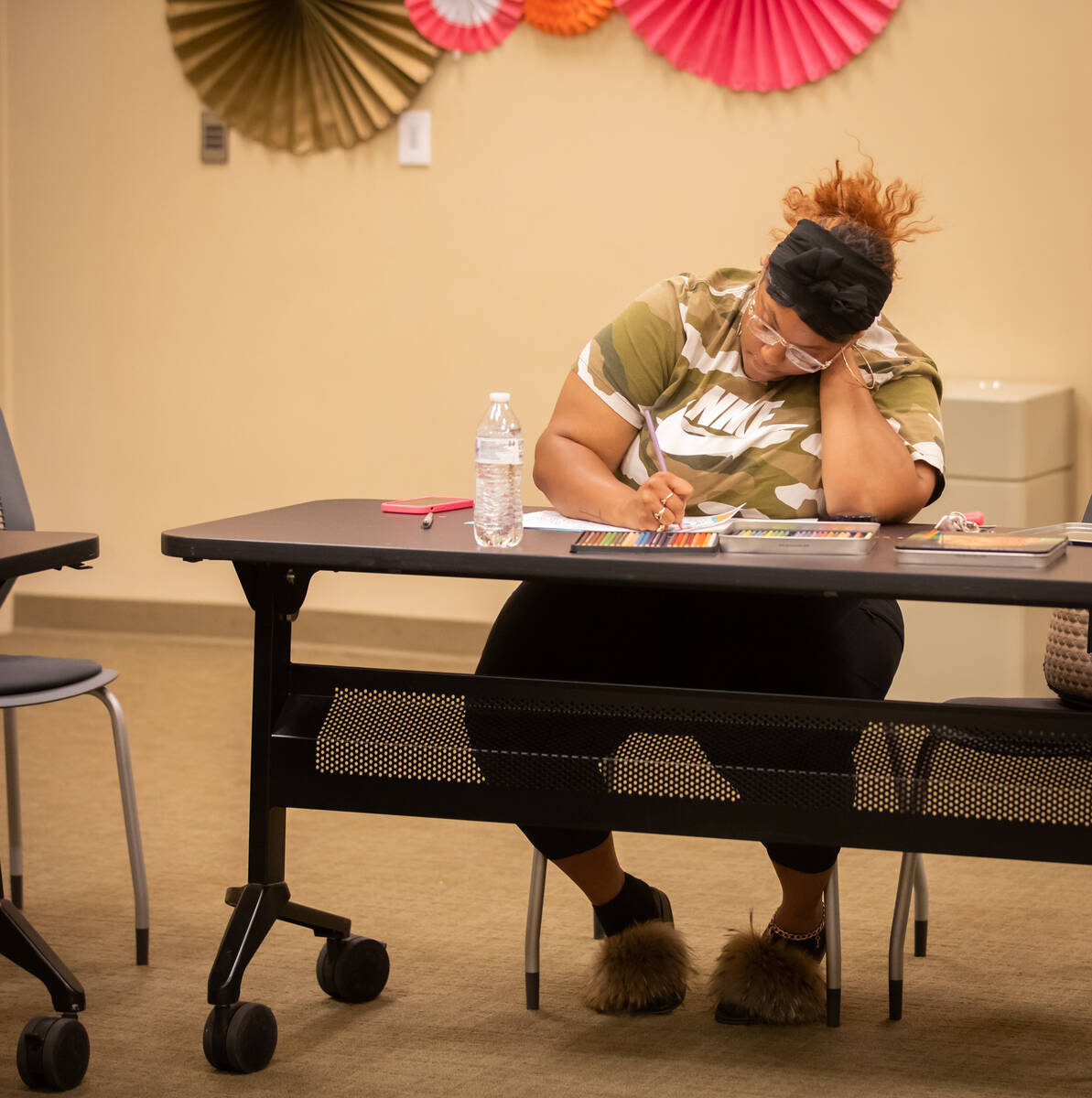 Royneqiuea Fields colors during an Adult Coloring and Journaling session at the Centennial Hill ...