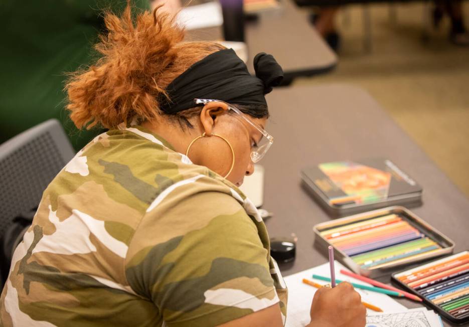 Royneqiuea Fields colors during an Adult Coloring and Journaling session at the Centennial Hill ...