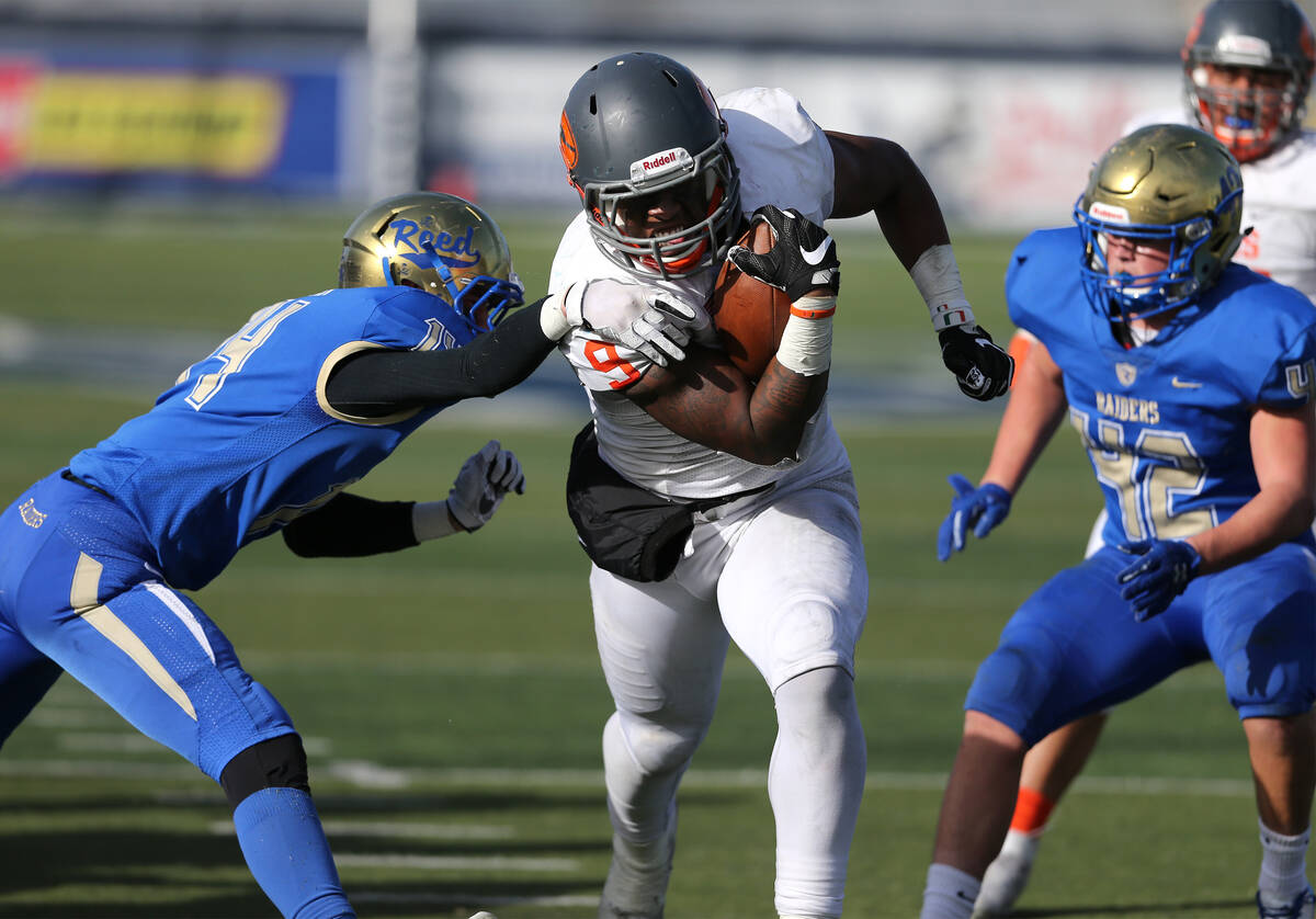 Bishop Gorman's Brevin Jordan runs for a touchdown against Reed in the first half of the NIAA 4 ...