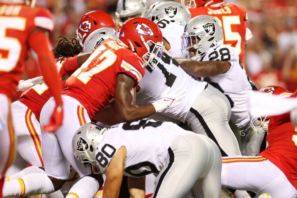 Raiders running back Josh Jacobs (28) runs the ball for a touchdown against the Kansas City Chi ...