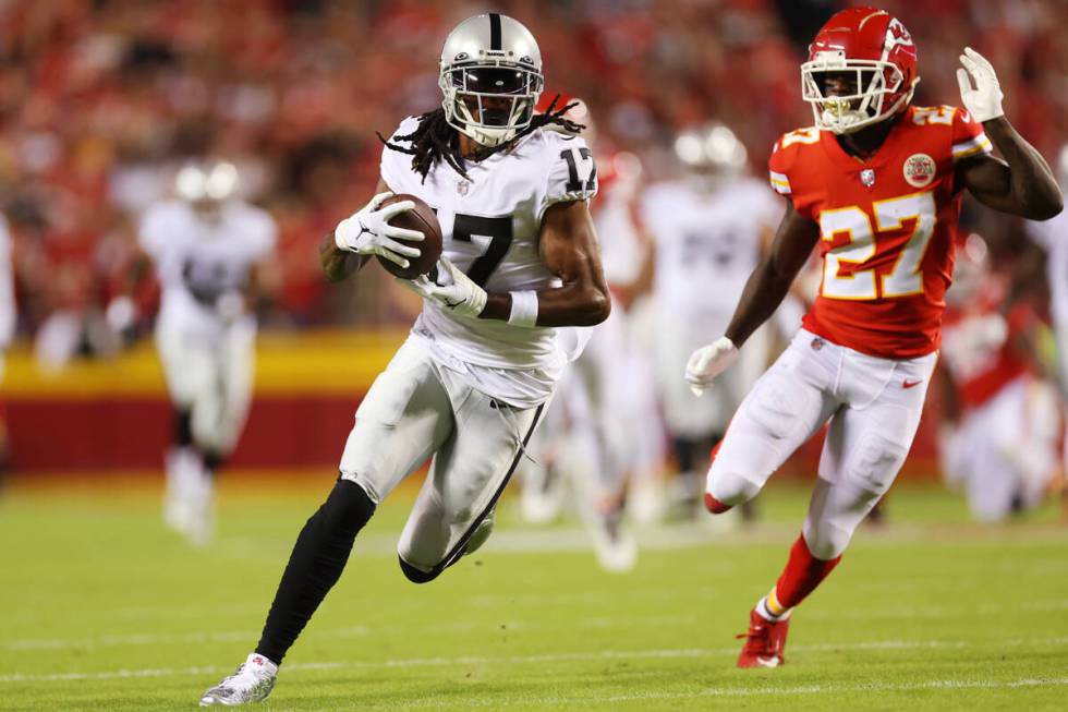 Raiders wide receiver Davante Adams (17) runs the ball for a touchdown after a catch as Kansas ...