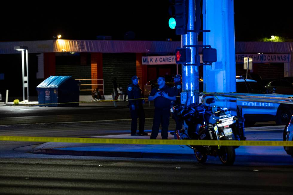 North Las Vegas police investigate the scene of an officer-involved shooting at Martin Luther K ...