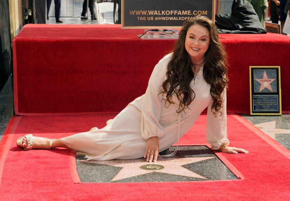 Singer/actress Sarah Brightman poses on her new star on the Hollywood Walk of Fame during a cer ...