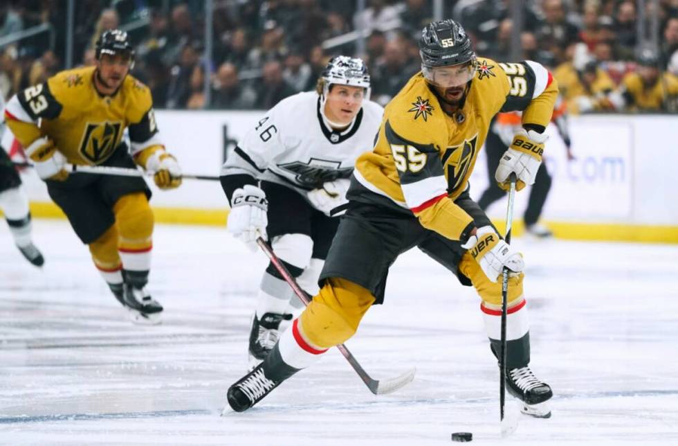 Vegas Golden Knights' Keegan Kolesar moves the puck past Los Angeles Kings' Blake Lizotte durin ...