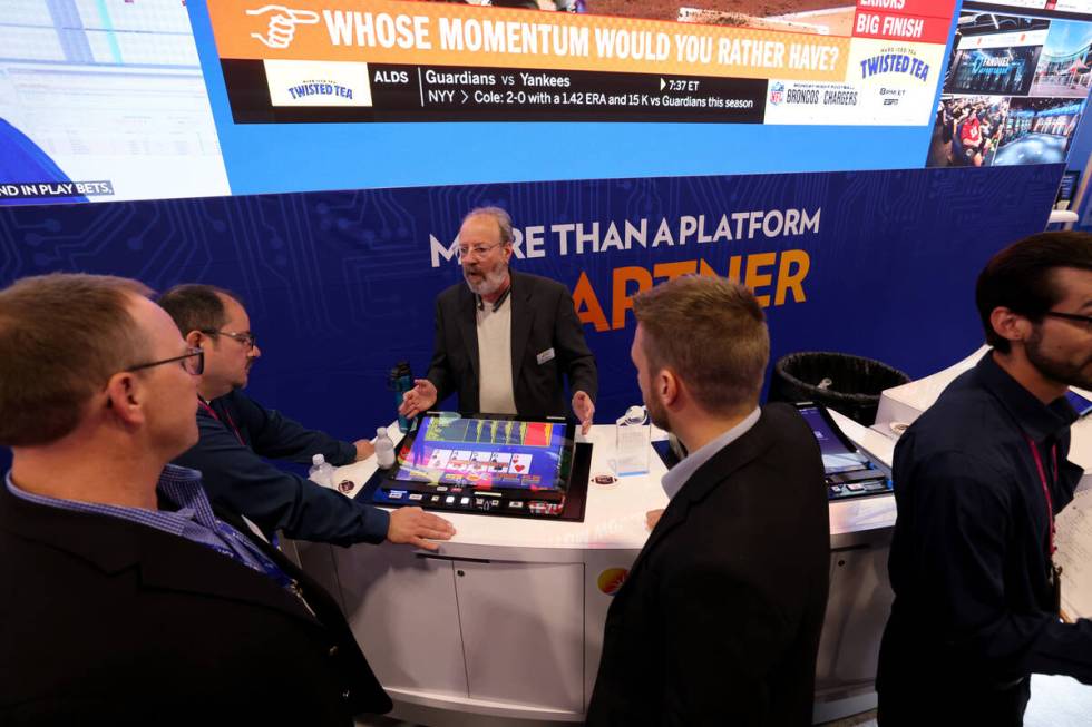 International Game Technology Senior Product Manager Poker Products Sid Lazarus shows a bar top ...