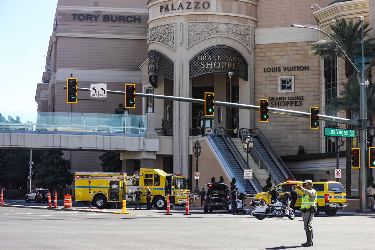 Police at the scene where multiple people were stabbed in front of a Strip casino in Las Vegas, ...