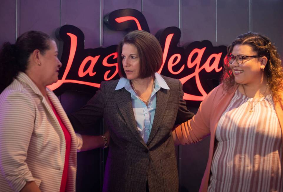 Sen. Catherine Cortez Masto, D-Nev., center, poses for photos with Dreamer Victoria Izamar , ri ...