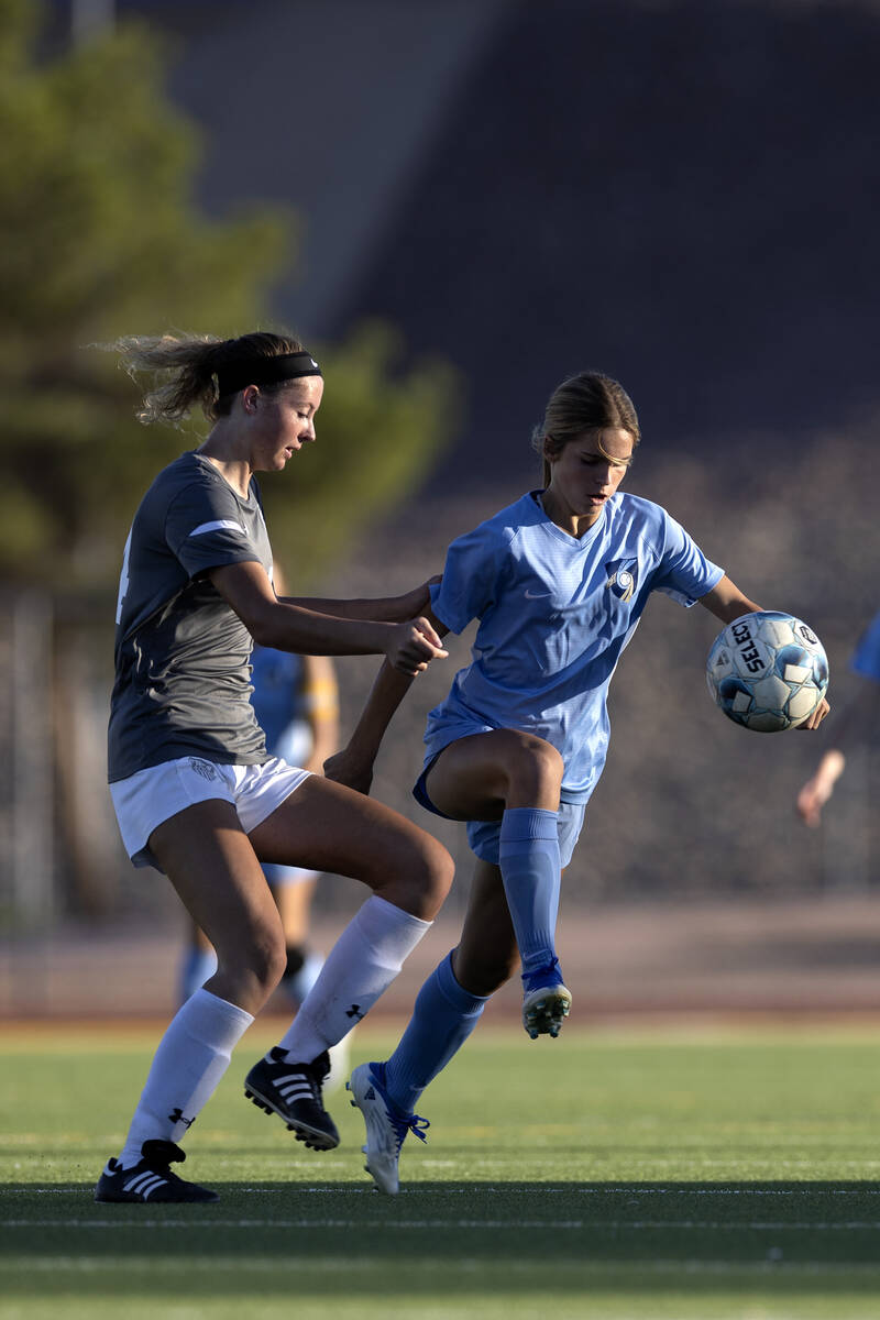 Foothill’s Hailey Grounman, right, jumps to kick against Arbor View’s Madison Lit ...