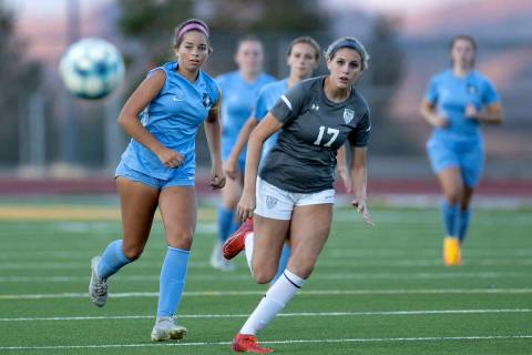Foothill’s Isabelle Simoneau, left, and Arbor View’s Madison McCraw (17) watch a ...