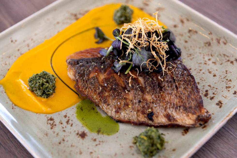 Honey Salt’s striped bass with carrot puree, pumpkin seed pesto and watercress at the re ...