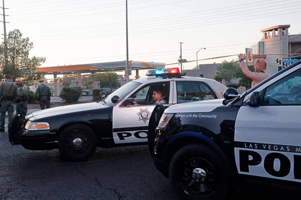 Las Vegas police investigate around the 800 block of East Flamingo Road after a shooting on Thu ...