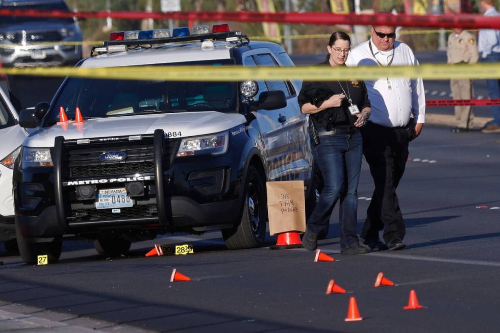 Las Vegas police investigate around the 800 block of East Flamingo Road after a shooting on Thu ...