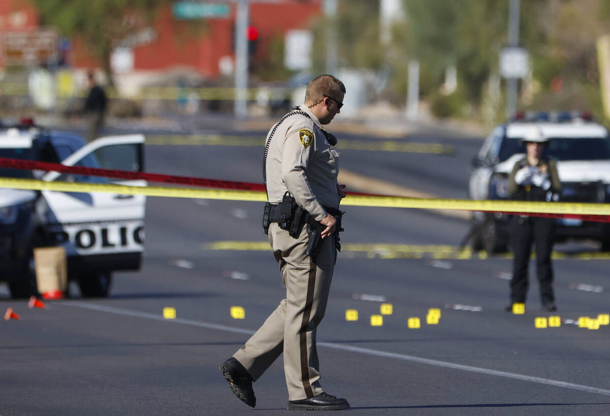 Las Vegas police investigate the scene on East Flamingo Road after a shooting that fatally woun ...