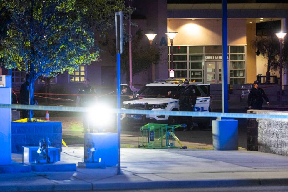 North Las Vegas police investigate the scene of an officer-involved shooting at Martin Luther K ...