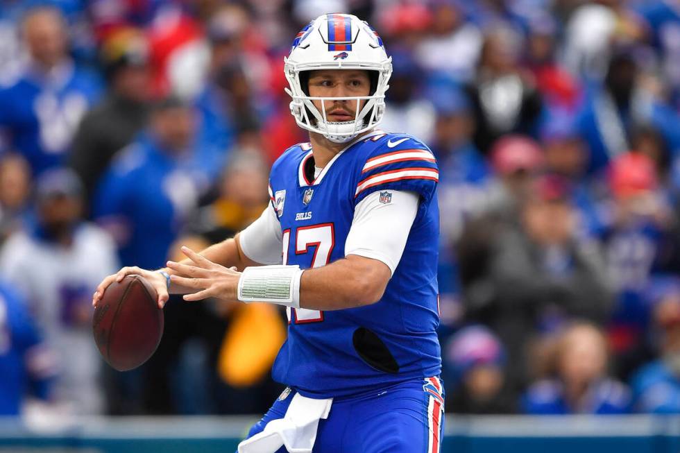 Buffalo Bills quarterback Josh Allen (17) looks to pass during the first half of an NFL footbal ...