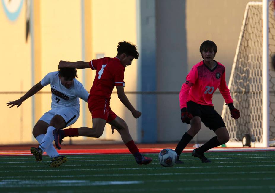 Western's Angel Ornelas (4) looks to attempt a shot against Desert Oasis goalkeeper Kenton Geli ...