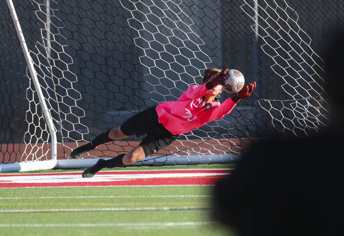 Desert Oasis goalkeeper Kenton Gelis (70) makes a save during a soccer game at Western High Sch ...