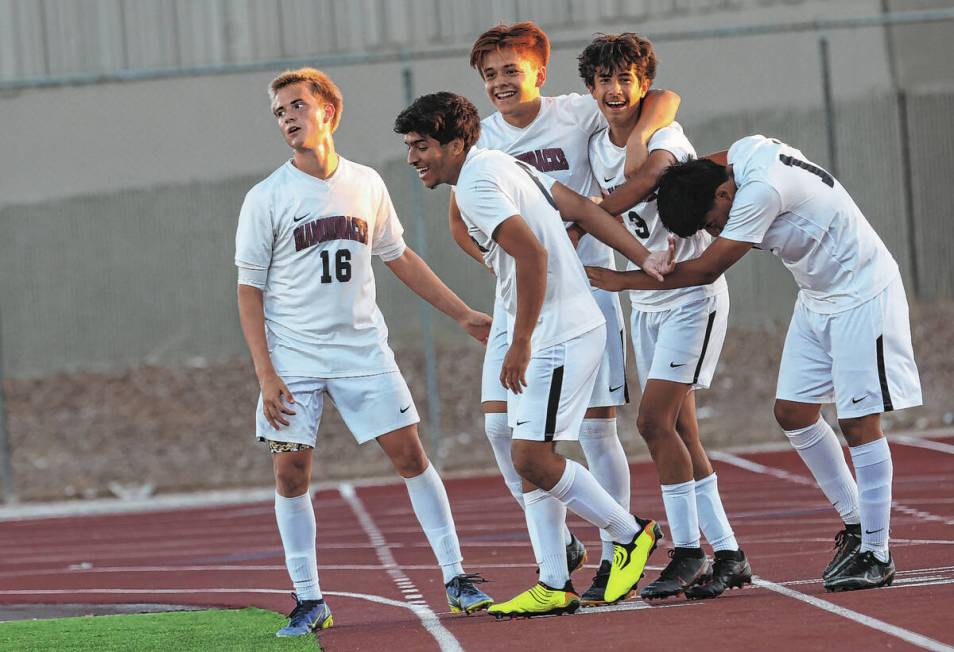 Desert Oasis' Lazzar Ramos (3) celebrates with teammates after scoring against Western during a ...