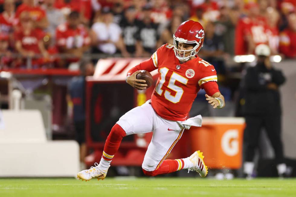 Kansas City Chiefs quarterback Patrick Mahomes (15) runs the ball during the first half of a NF ...