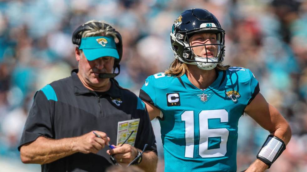 Jacksonville Jaguars head coach Doug Pederson with quarterback Trevor Lawrence (16) during an i ...