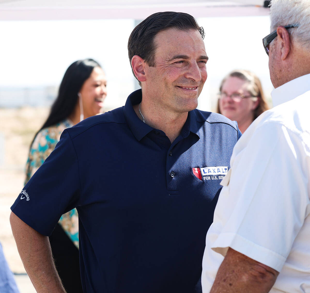 U.S. Senate candidate Adam Laxalt greets supporters prior to a panel discussing energy policy o ...