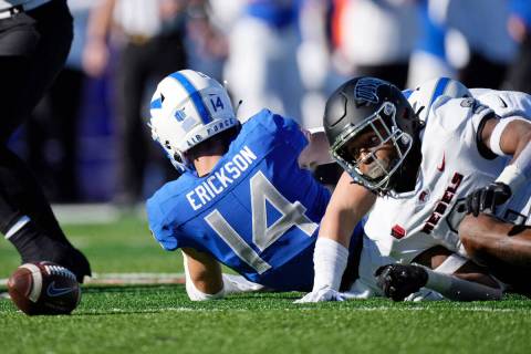 UNLV kick returner Nohl Williams, right, fumbles the football after being hit by an Air Force p ...