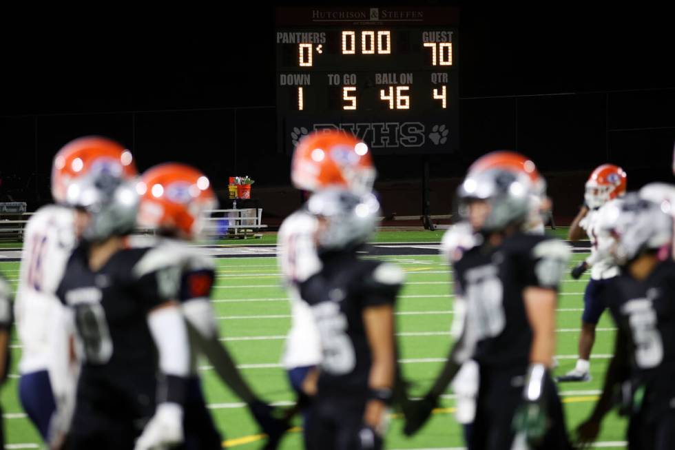 The scoreboard show Bishop Gorman winning the game 70-0 against Palo Verde for the final score ...