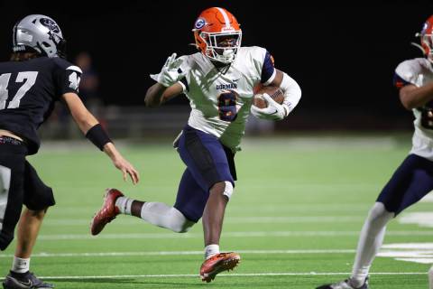 Bishop Gorman's Jayden House (8) runs the ball during the first half of a football game against ...