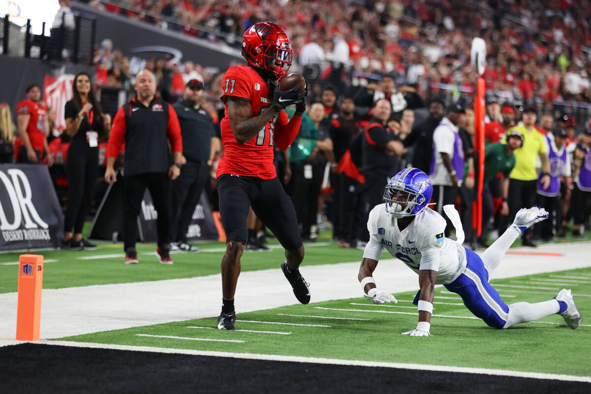 UNLV Rebels wide receiver Ricky White (11) makes a catch as Air Force Falcons cornerback Michae ...