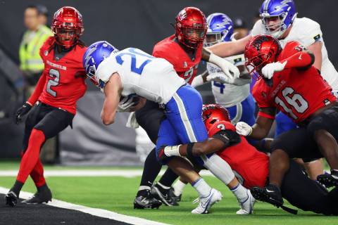 Air Force Falcons running back Brad Roberts (20) dives for a touchdown as her is tackled by UNL ...