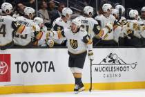 Vegas Golden Knights center Jonathan Marchessault celebrates with the bench after scoring a goa ...