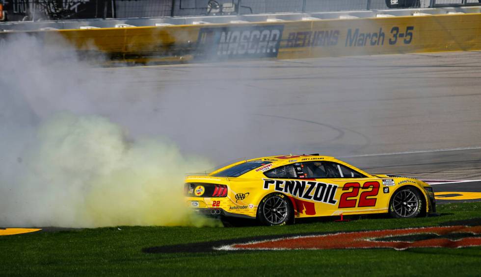 NASCAR Cup Series driver Joey Logano does a burnout after winning the South Point 400 NASCAR Cu ...