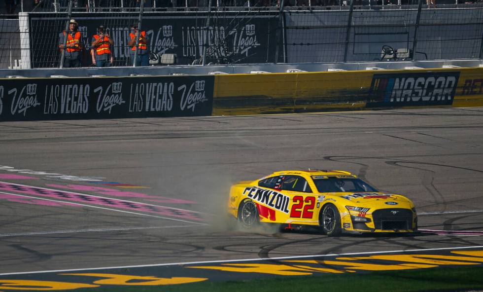 NASCAR Cup Series driver Joey Logano does a burnout after winning the South Point 400 NASCAR Cu ...