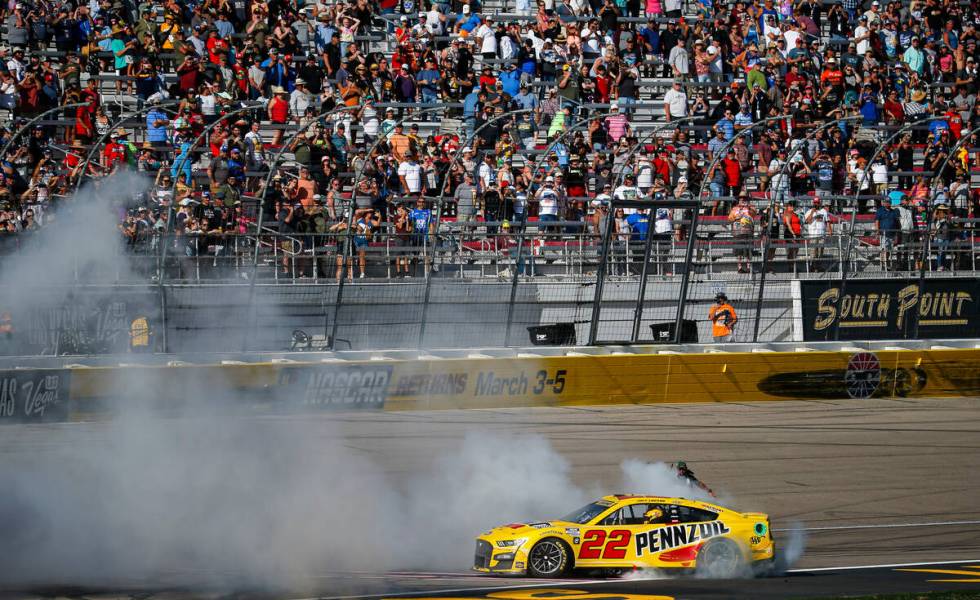 NASCAR Cup Series driver Joey Logano does a burnout after winning the South Point 400 NASCAR Cu ...