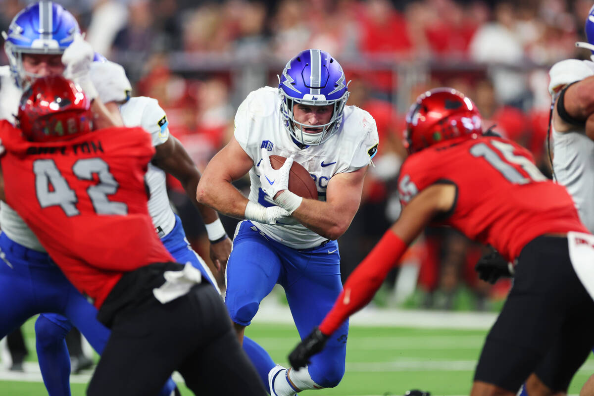 Air Force Falcons running back Brad Roberts (20) runs the ball against UNLV Rebels during the s ...