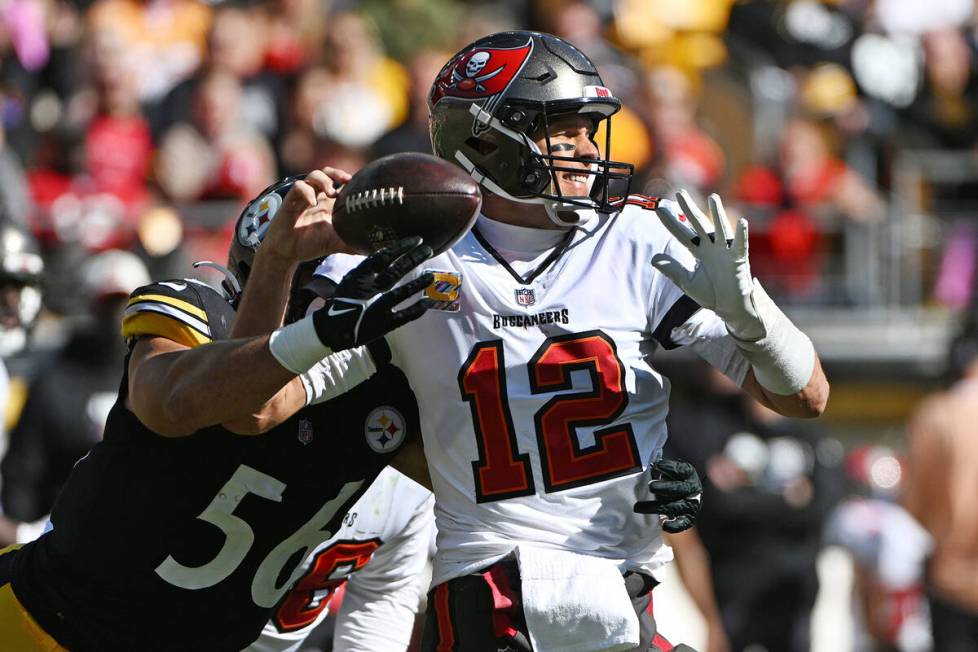 Pittsburgh Steelers linebacker Alex Highsmith (56) forces a fumble as he hits Tampa Bay Buccane ...